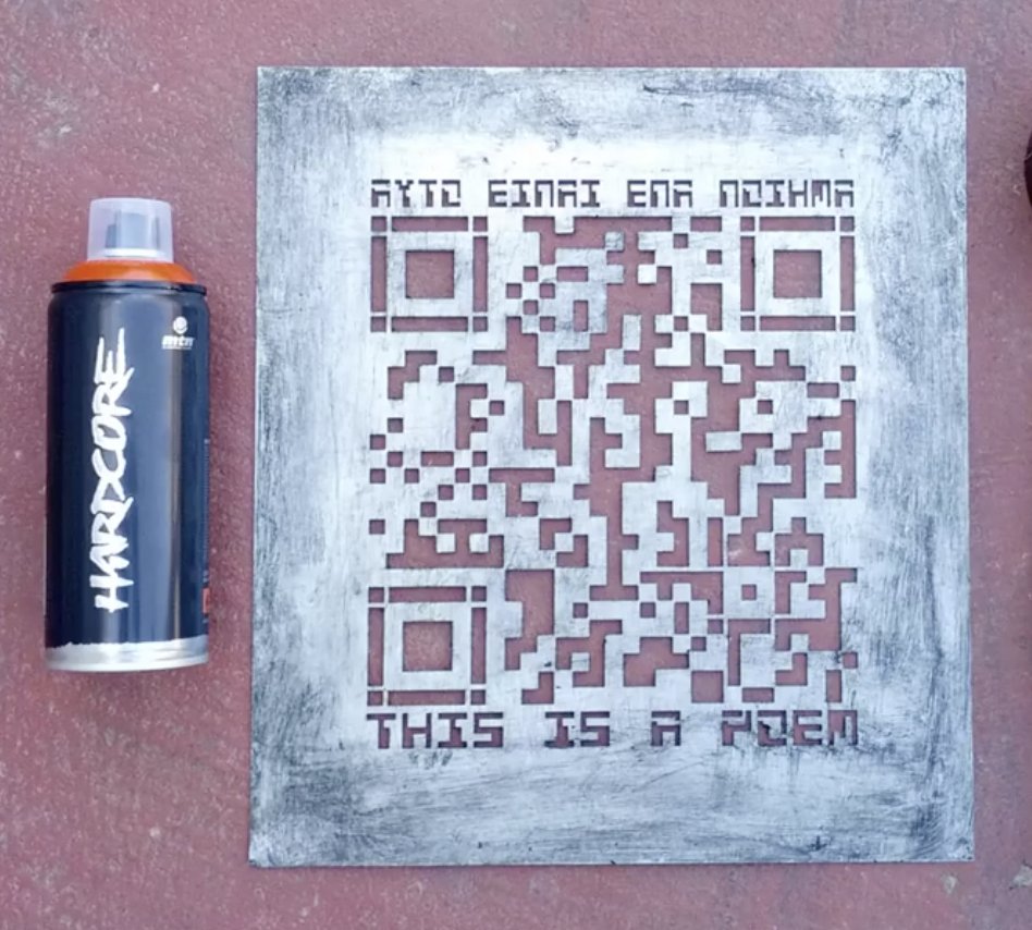 Code Poetry: stencilled QR code reading 'This is a poem' beside a spray can